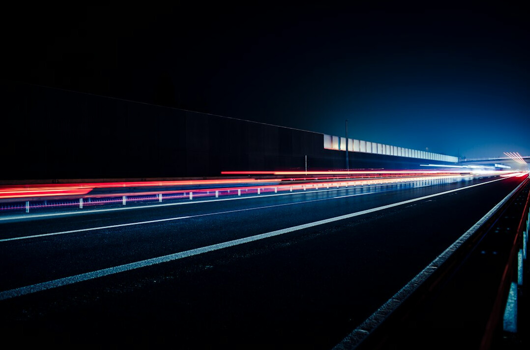 Car headlights on a road at night
