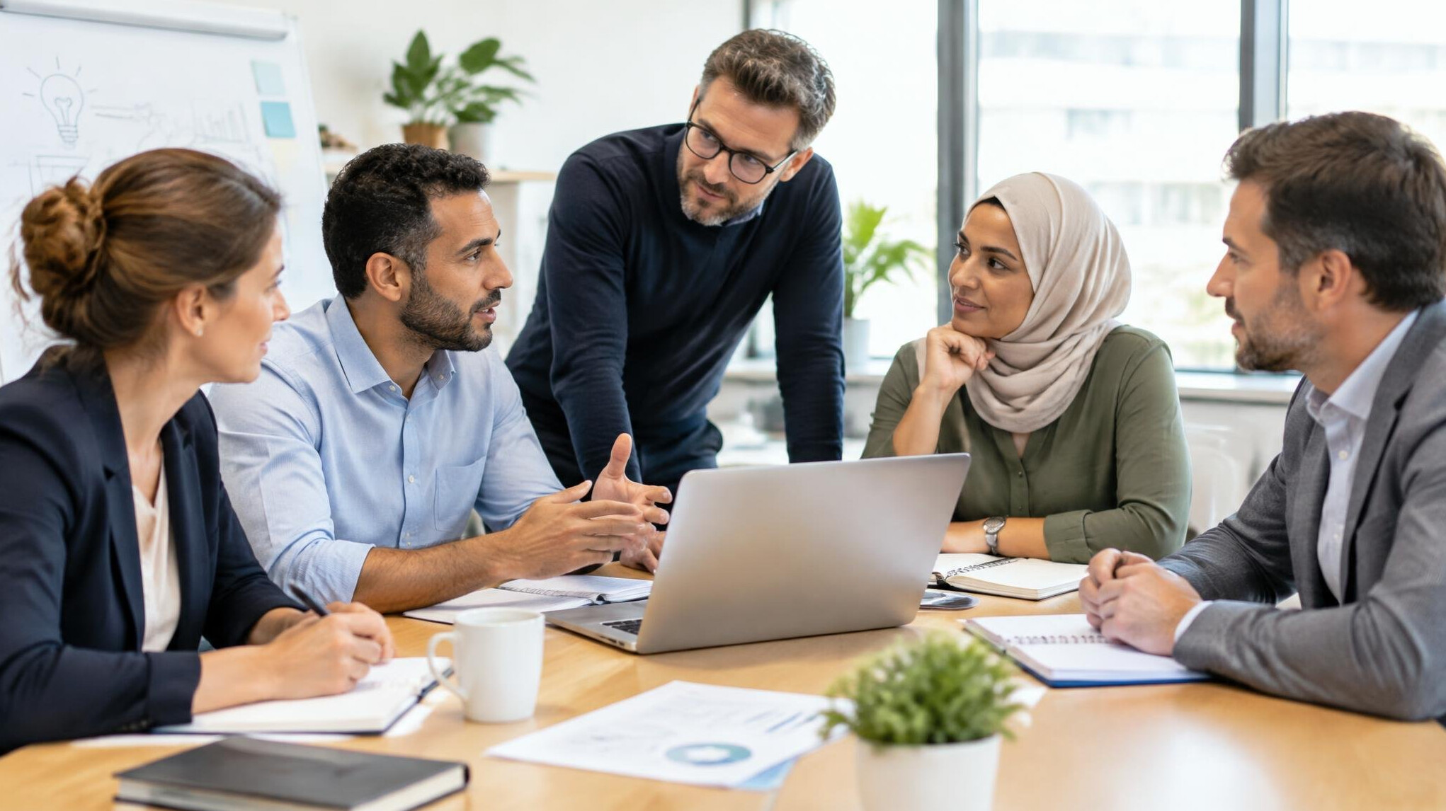 Team of professionals discussing around a table